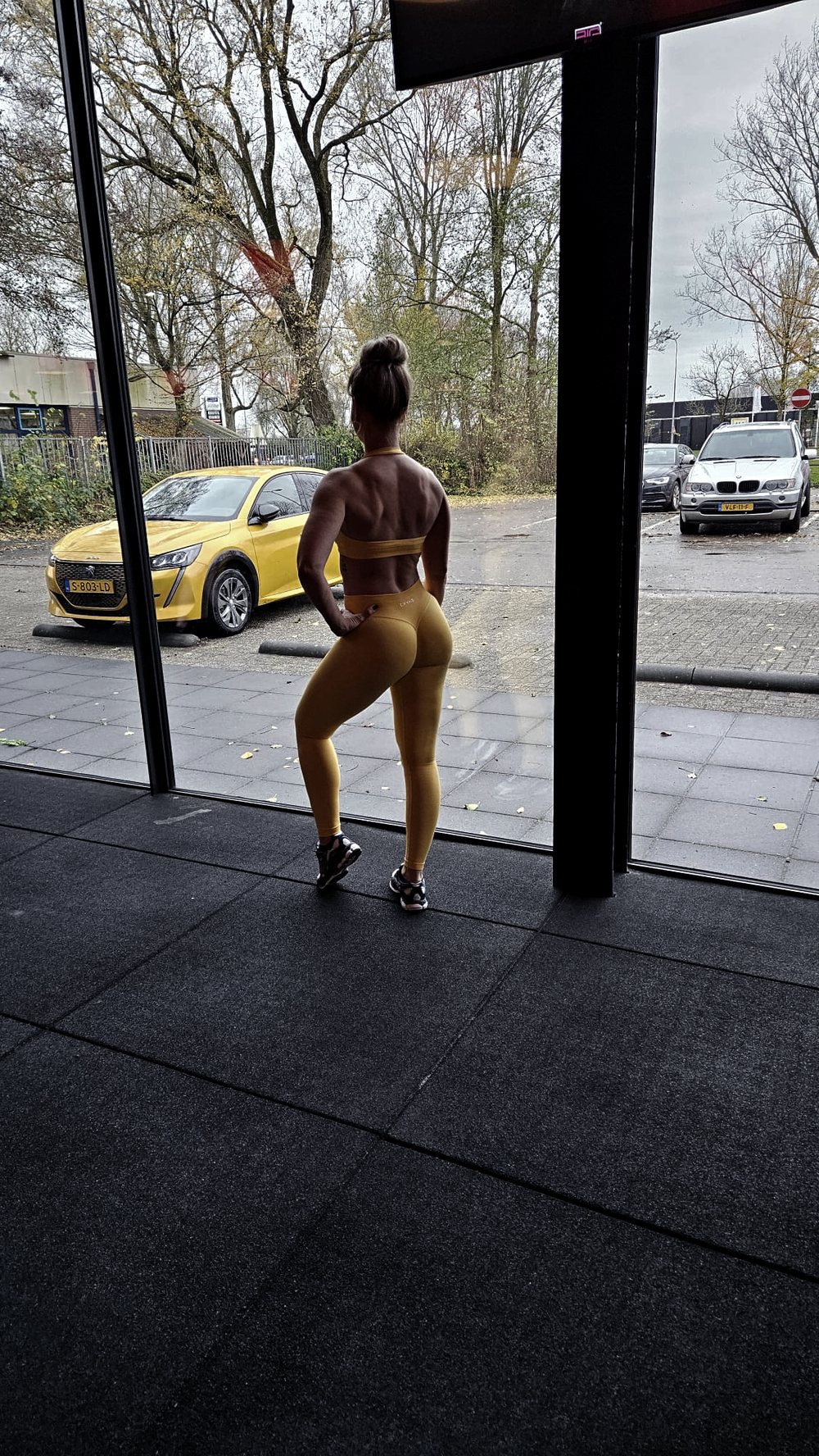 Client walking into the gym in training gear